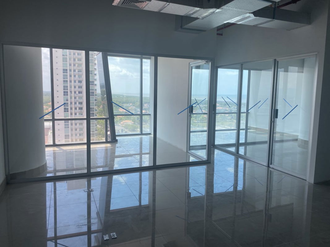 Interior commercial space with tempered glass gypsum divisions in new office tower Costa del Este Panama