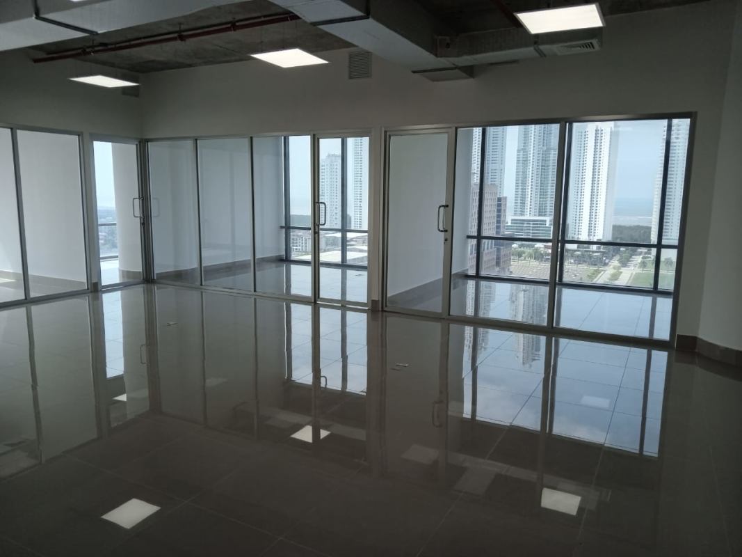 Large open office with glass partitions and skyline views at PH Financial Park Panama