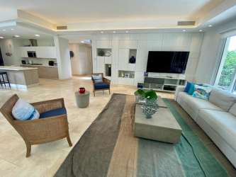 Spacious open-plan living area with marble floors in Puntarena Ocean Village Buenaventura