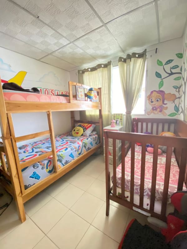 Child's bedroom with bunk bed crib and playful wall decals in Pacora Los Jardines Panama