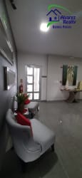 Secure condo entrance lobby with seating area and glass doors in Boquete Panama