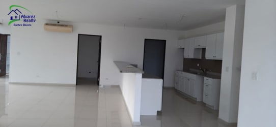 Open concept kitchen and dining area with light finishings in Boquete modern apartment