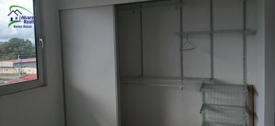 Spacious bedroom closet with shelving and sliding doors at Boquete Vista Panama