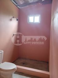 Unfurnished room tiled floor window peach walls country house Las Tablas