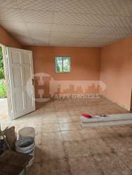 Covered outdoor patio with concrete wash sink tan walls overlooking garden San Jose Panama