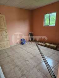 Basic bathroom peach walls white pedestal sink rural home Las Tablas Panama