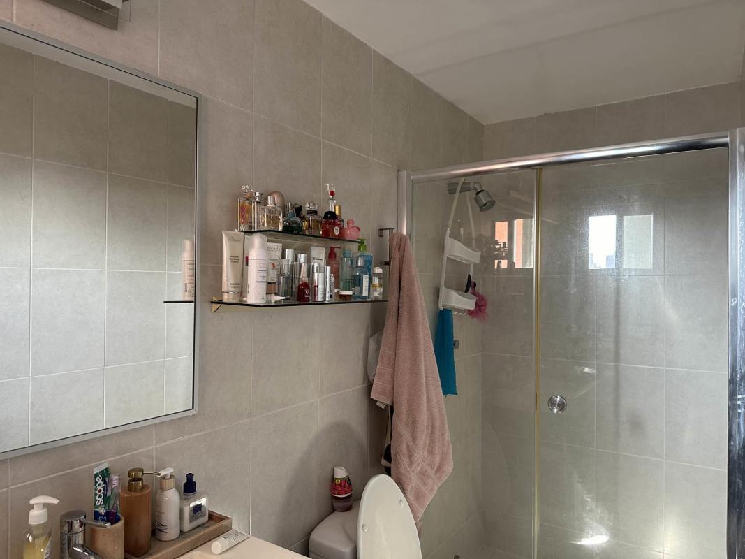 Bathroom with glass shower enclosure modern fixtures PH Miyaki Obarrio Panama