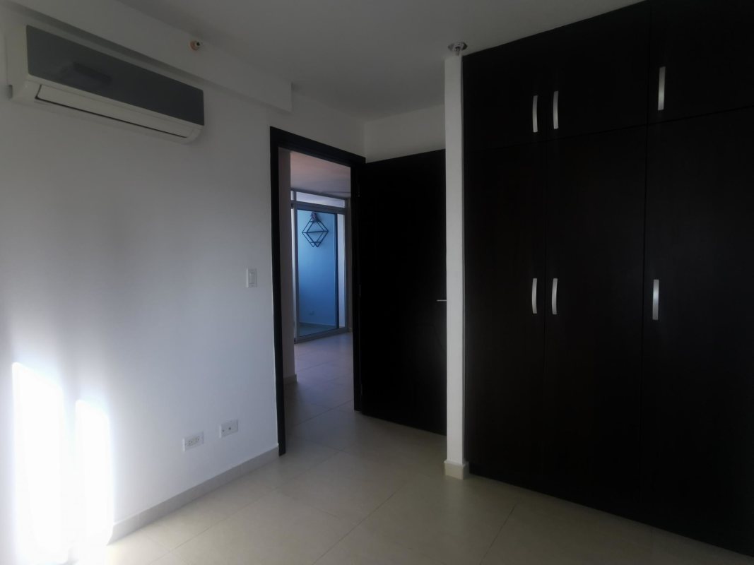 Spacious open-plan living dining room with balcony access and city ocean view PH Vista Park Carrasquilla Panama