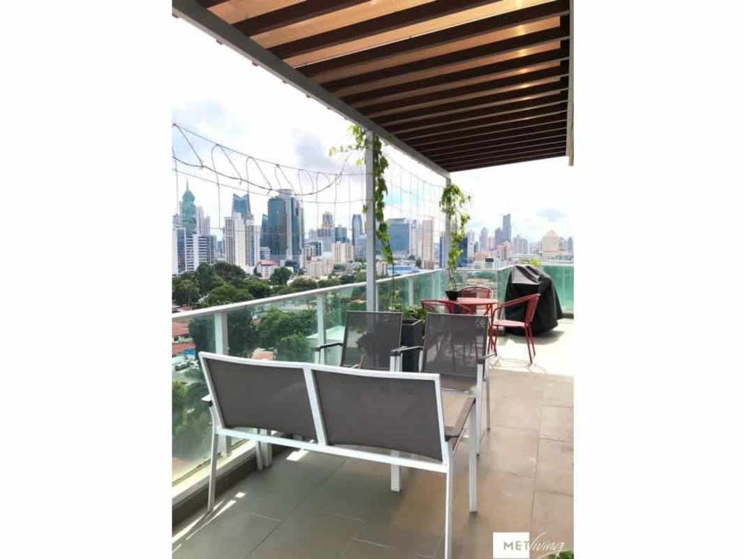 Stylish kitchen featuring granite surfaces and wood cabinets in Cosmopolitan