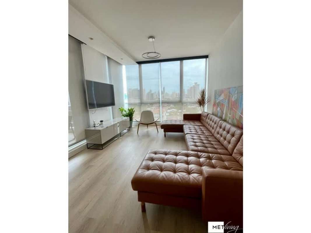 Spacious outdoor terrace with barbecue and seating area overlooking city in PH Cosmopolitan