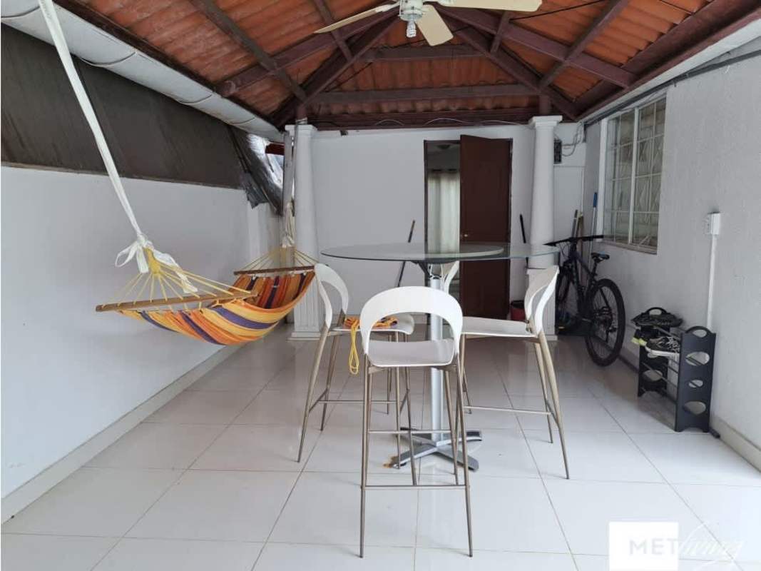 Bedroom with wood flooring, bright window, minimalist decor, Obarrio house for sale Panama