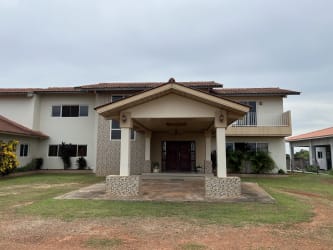 Kitchen with island stove granite counters large windows Via 4 Caminos Chitré