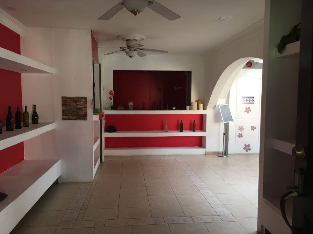 Colonial stairwell with arched window and chandelier commercial property in Clayton Panama