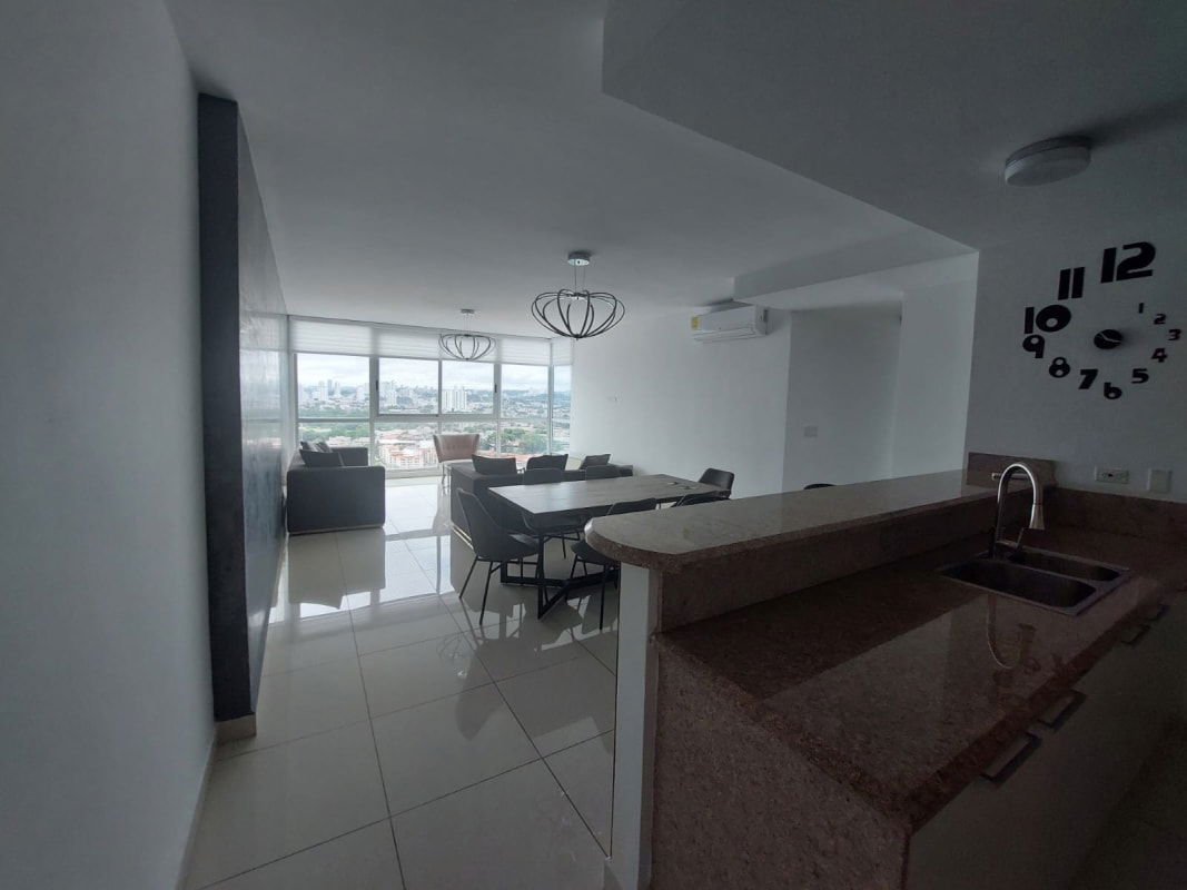 Spacious living and dining room with large windows city view Costa del Este Panama apartment