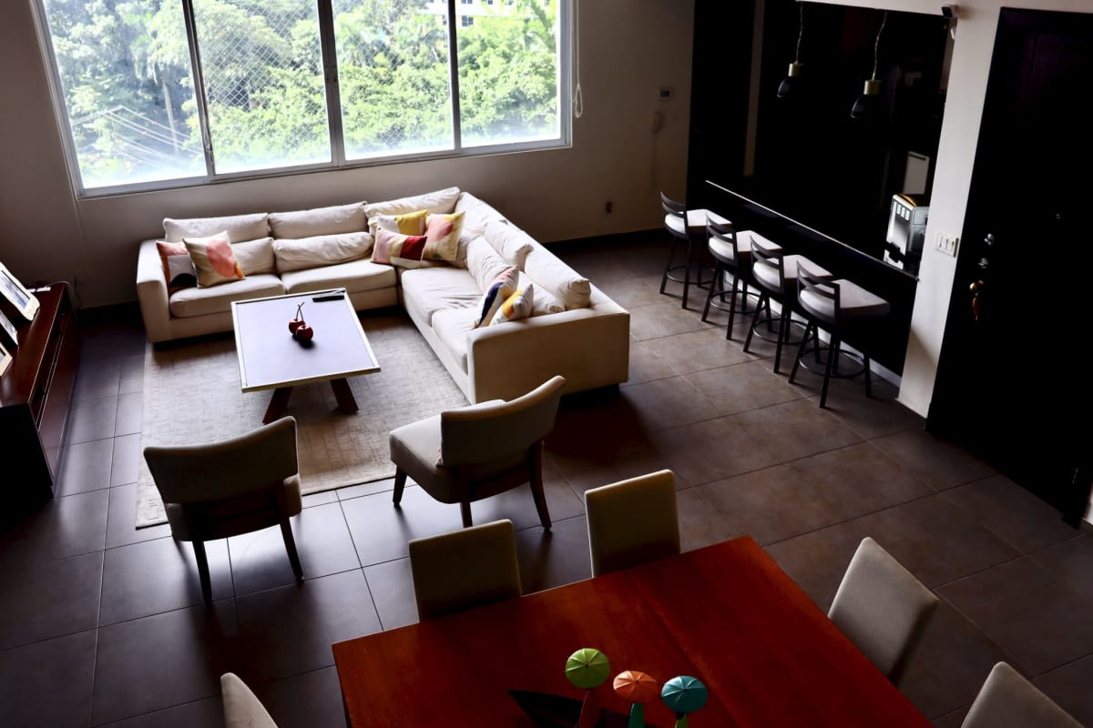 View of the mezzanine loft area overlooking spacious living room PH Portanova Panama City