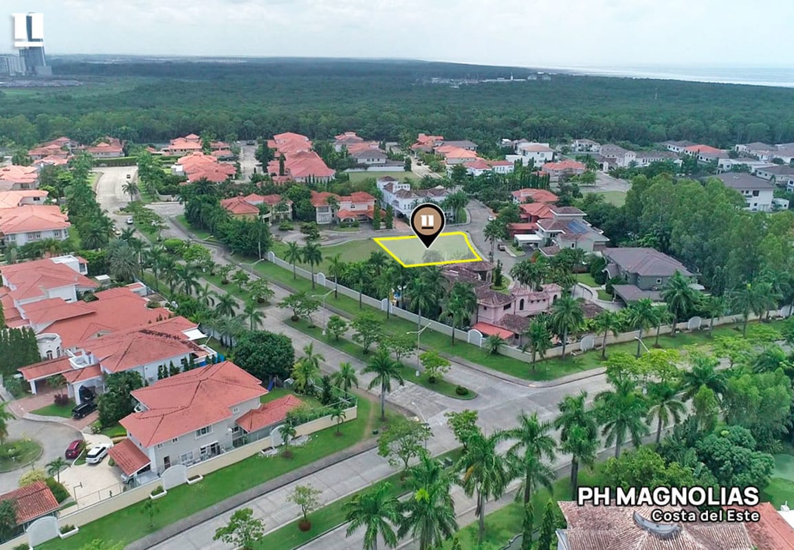 Aerial view of residential neighborhood with empty lot highlighted in PH Magnolias exclusive gated Costa del Este Panama City