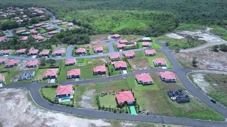 Planned residential homes with red roofs and green yards Hacienda Pacifica Panama