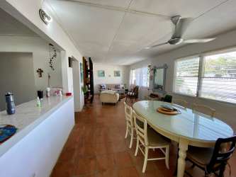 Private pool area surrounded by palm trees in Playa Gorgona Panama beach home