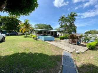 Guest house bedroom with twin beds and coastal decor Nueva Gorgona Panama
