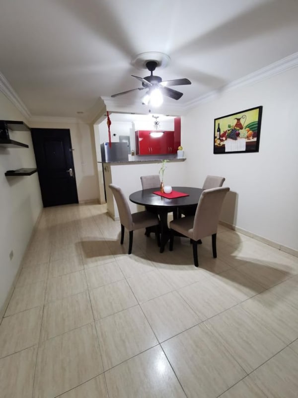Dining area with round table near semi-open kitchen PH Sunset Park Via Porras Panama