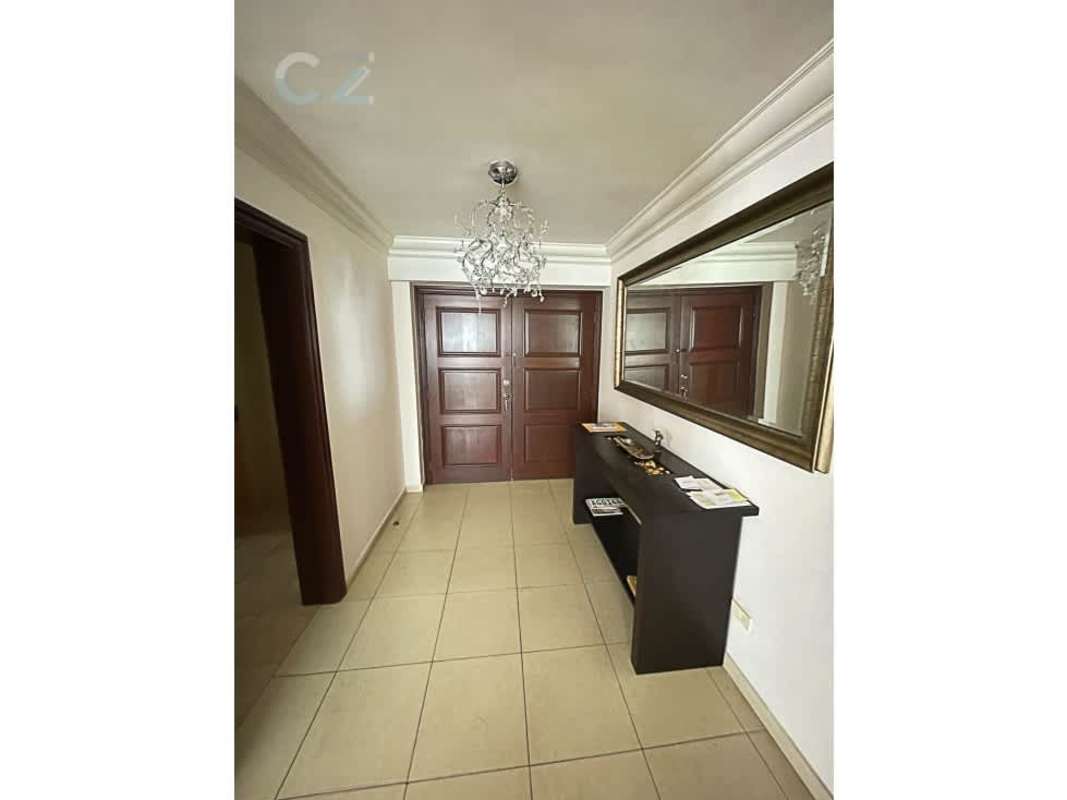 Spacious kitchen with wooden cabinets granite countertops double-door fridge in PH Sol Marina Marbella Panama