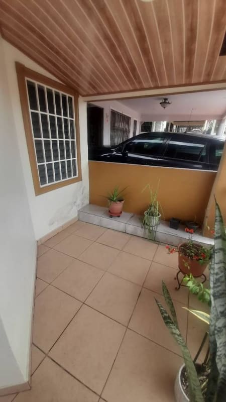 Residential kitchen with cabinets refrigerator stove in Villa Lucre house for sale