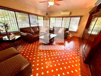 Spacious gourmet kitchen with granite countertop island, wood cabinetry in El Valle luxury estate Panama