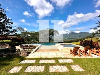 Covered outdoor terrace with hammock and stone floors at country estate El Valle Panama