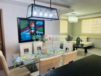 Living room with white sectional sofa and decor Villas del Golf Chitre Panama