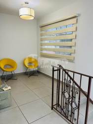 Landing with yellow chairs zebra blinds Villas del Golf Panama