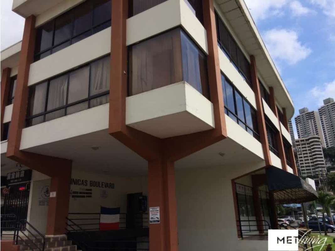 Modern commercial building exterior with large windows corner lot at El Dorado Panama