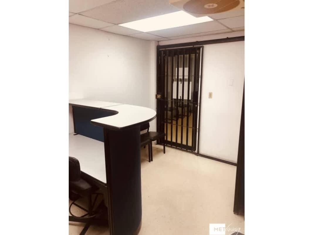 Office reception with security gate and signage at Torre Empresarial El Dorado Panama