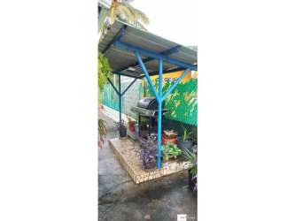 Barbecue outdoor kitchen under metal roof tropical yard Gorgona San Carlos Panama