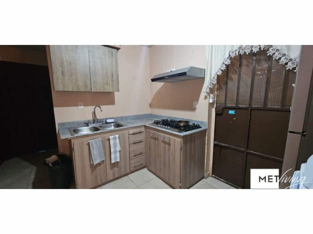 Kitchen with granite countertops and wood cabinets house for rent Pedregal Panama