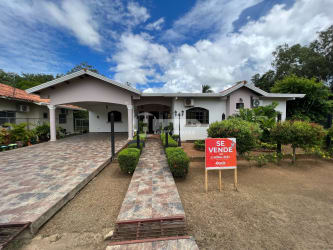 Covered patio area with hammock garden view and tropical plants Chitré Panama