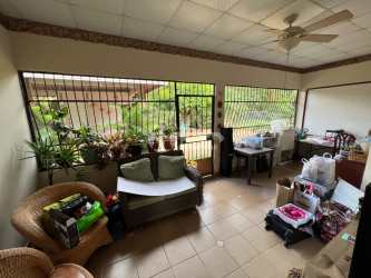 Dining room with large bay window tile floors and ample space in family house Chitré Herrera