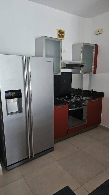 Spacious living area with large sliding glass doors leading to ocean view balcony at PH Destiny Tower Panama