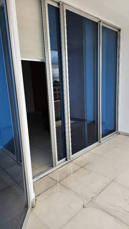 Large balcony with glass railing offering panoramic Pacific Ocean and Cinta Costera views PH Destiny Tower Panama City