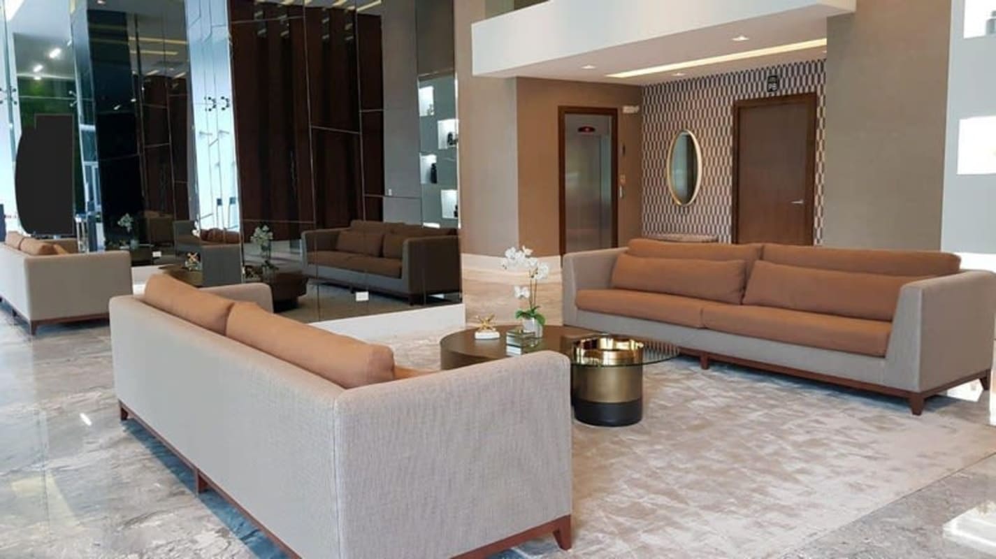 Spacious modern lobby with high ceilings and decorative finishes at PH Regalia Costa del Este