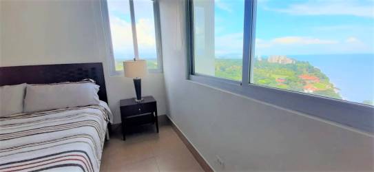 Nighttime illuminated pools with palm trees Rio Mar Beachfront Resort Panama