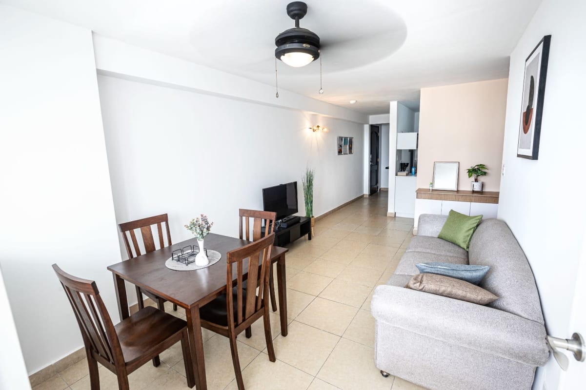 Bright living dining area with tile flooring and large windows city views at PH Bella Vista Garden Obarrio