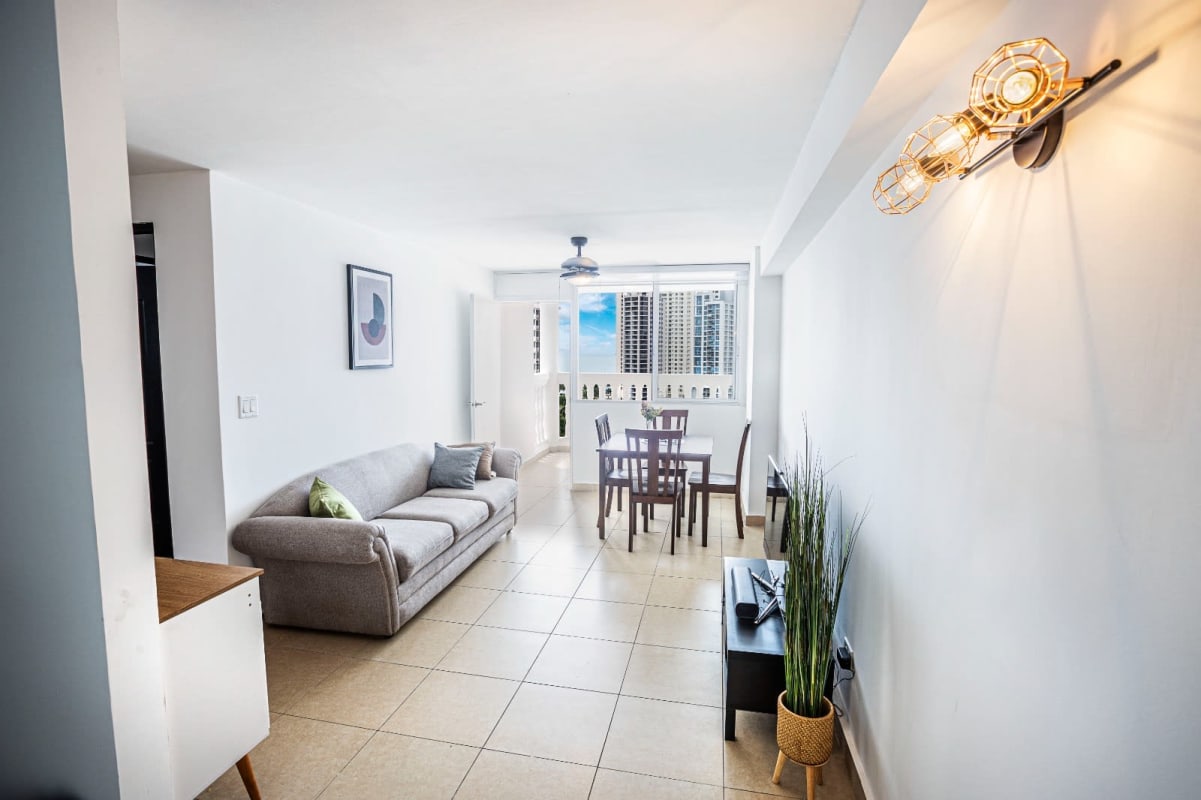 Compact kitchen with granite counters, appliances, and open design at PH Bella Vista Garden