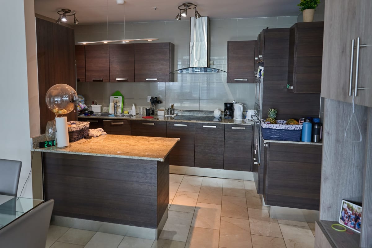 Living room with floor-to-ceiling windows overlooking Panama skyline at Grand Tower Punta Pacifica