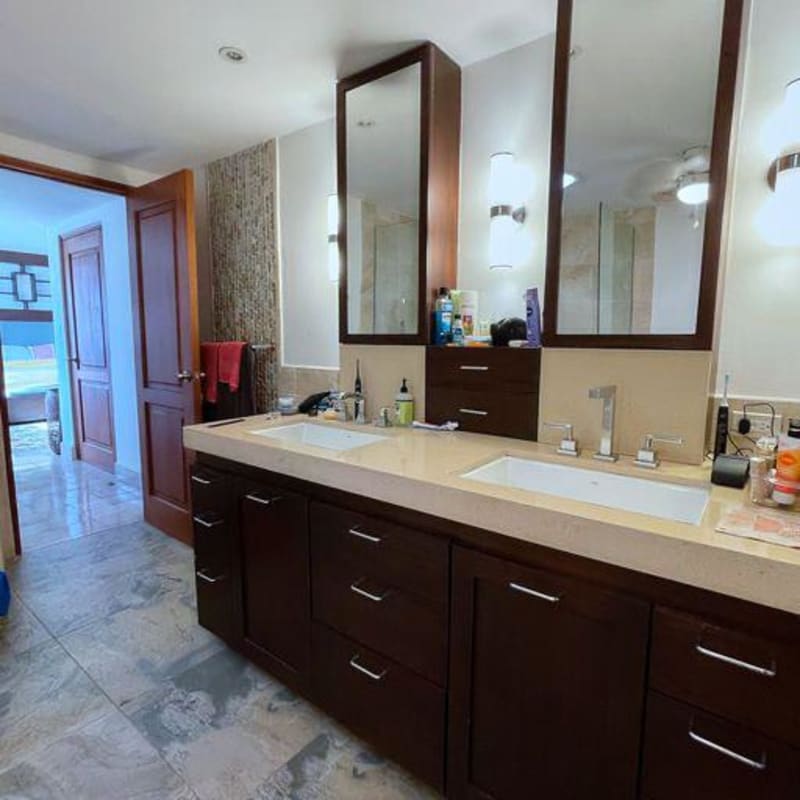 Modern kitchen with granite countertop, glass cabinets, stainless appliances in PH 4 Casas Casco Viejo Panama City