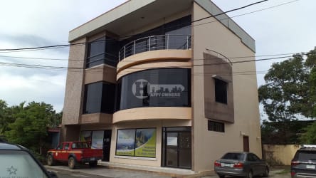 Vacant office space with tiled floor and large windows inside commercial building in Chitré Panama