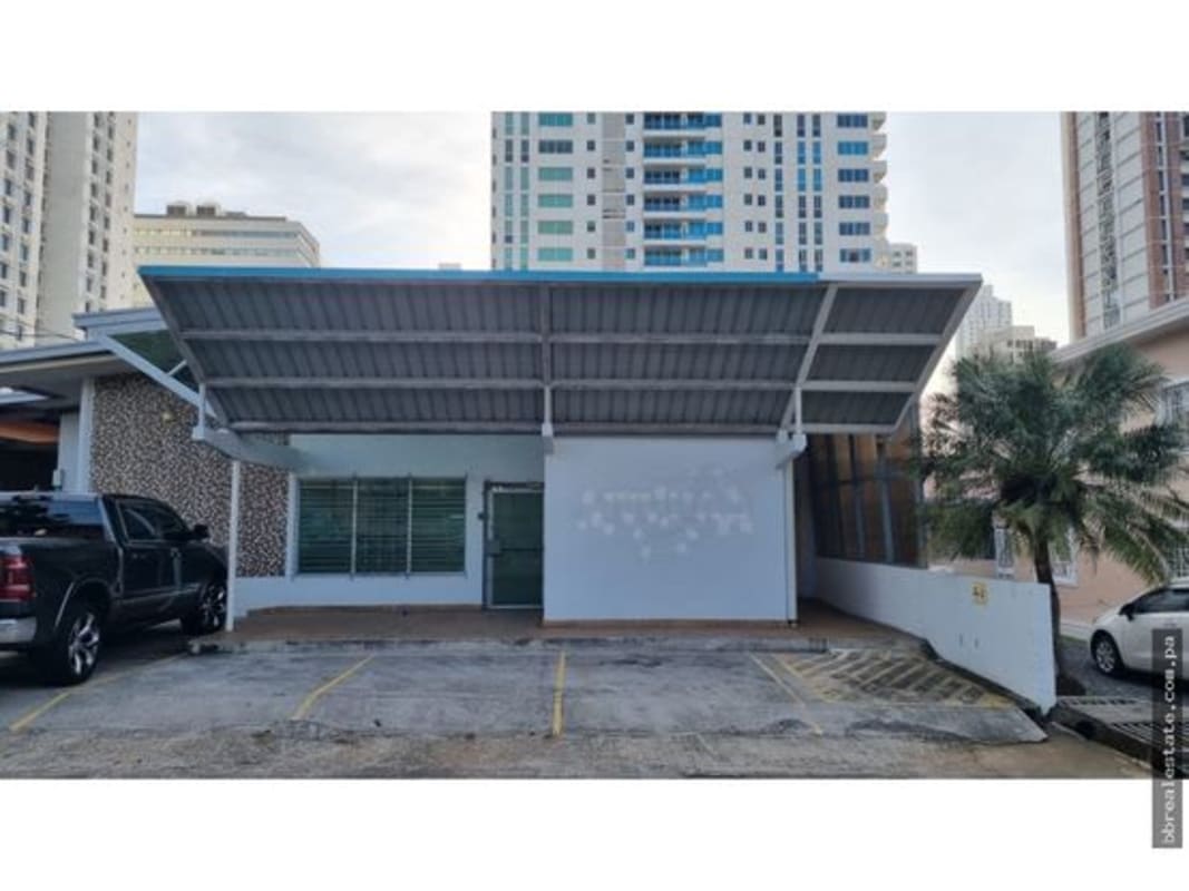 Entrance to office restrooms with frosted glass doors and signage in Via Porras Panama