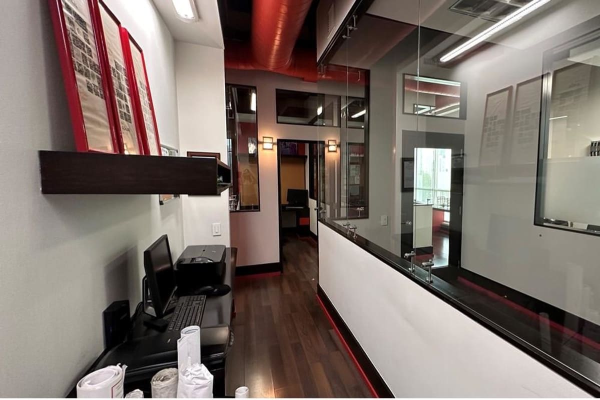 Modern office corridor with industrial red ductwork and natural light in PH Blue Business Center San Francisco Panama