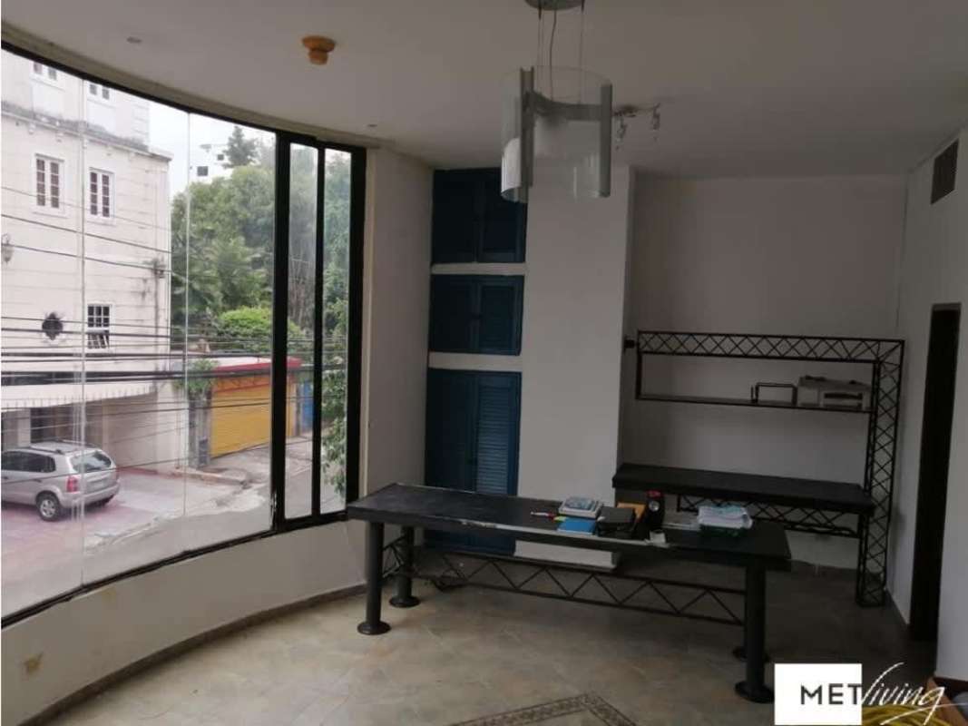 Office interior large curved window built-in shelves PH Metric San Francisco Panama