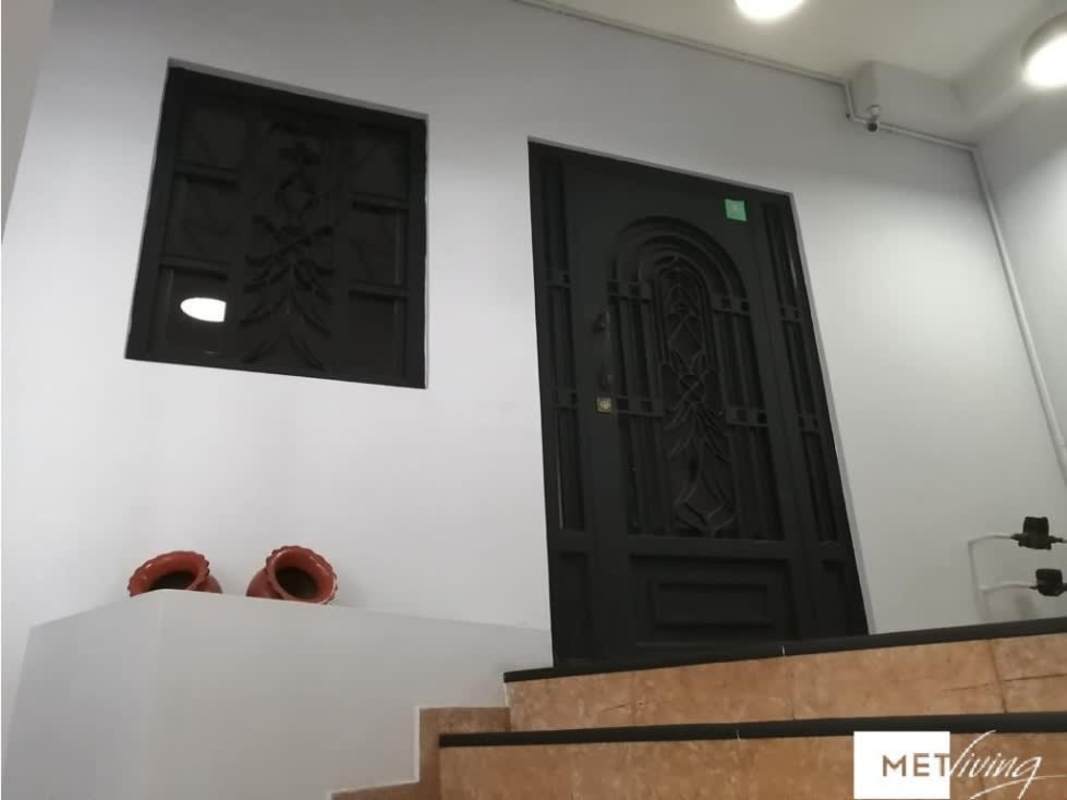 Entry landing black iron security door window PH Metric San Francisco Panama