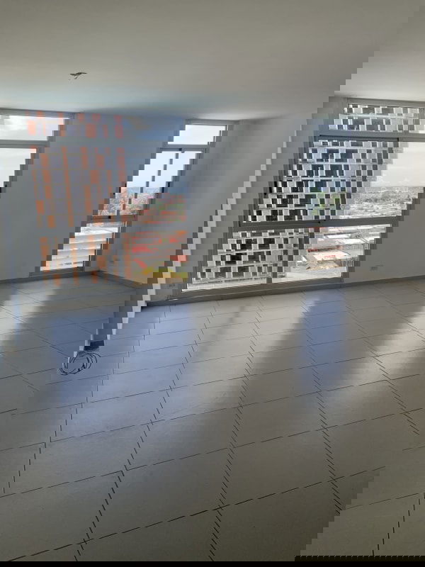 Living-dining area with access to covered balcony in PH Torres del Este Panama